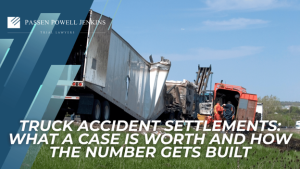 Damaged semi-truck and emergency responders at a crash scene introduce truck accident settlements and case valuation.